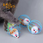 Gray cat investigating rolling mouse-in-a-cage toys