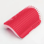 Red wall-mounted cat grooming brush