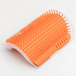 Orange wall-mounted cat grooming brush