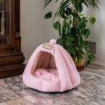 Soft Pink Armarkat C95GFS cat cave beside a cabinet and plant