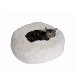 A tabby cat rests in a plush Armarkat cuddler bed