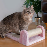 A tabby cat sits beside the sisal roller of the Pink Armarkat X0602 scratcher