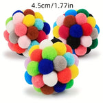 Colorful pom-pom cat toy ball with a size indicator