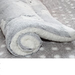 Gray bear-patterned coral fleece cat resting mat with a rolled corner showing the white underside