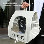 White cat backpack carrier held by its top handle, showing mesh side panels and clear front window