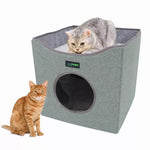 A silver tabby rests on the Sage Green JESPET cat cube with an orange tabby beside the cubby opening