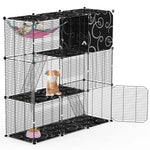 Black three-tier cat enclosure with a cat in the pink hammock, another cat beside the hanging toy, and an open lower door.