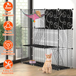 Black three-tier cat enclosure beside a window, with a pink hammock and an orange cat at the open door.