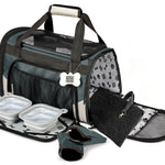 Gray Carrier Plus showing the open entrance, padded interior, bowls, food containers and placemat