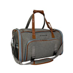 Platinum Gray Big Apple carrier with both expandable sides zipped closed and its padded shoulder strap attached