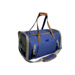 Rear three-quarter view of the Deja Blue Mr. Peanut's Gold Mini carrier, showing its end mesh panel, pocket and shoulder strap.