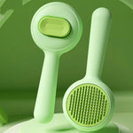 Green self-cleaning cat grooming brush