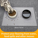 Cat feeding mat beneath food and water bowls, showing its 48 by 30 cm dimensions.