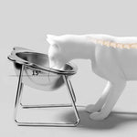 Side view of a cat using the stainless steel bowl, showing the stand and 15-degree tilt.