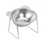 Silver stainless steel cat-ear bowl resting in a raised metal stand on a white background.