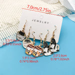 Teacup cat earring size guide showing charms approximately 0.55–1.02 in (1.4–2.6 cm)