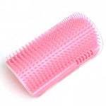 Pink wall-mounted cat grooming brush
